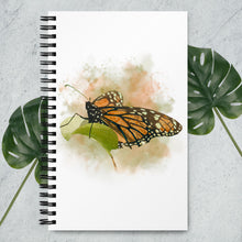 Load image into Gallery viewer, Butterfly notebook. The butterfly design was done in a watercolour-style.

