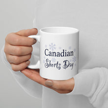 Load image into Gallery viewer, Canadian Shorts Day coffee mug held by a pair of hands
