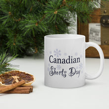 Load image into Gallery viewer, Coffee Mug decorated with snowflakes and the text &quot;Canadian Shorts Day&quot;

